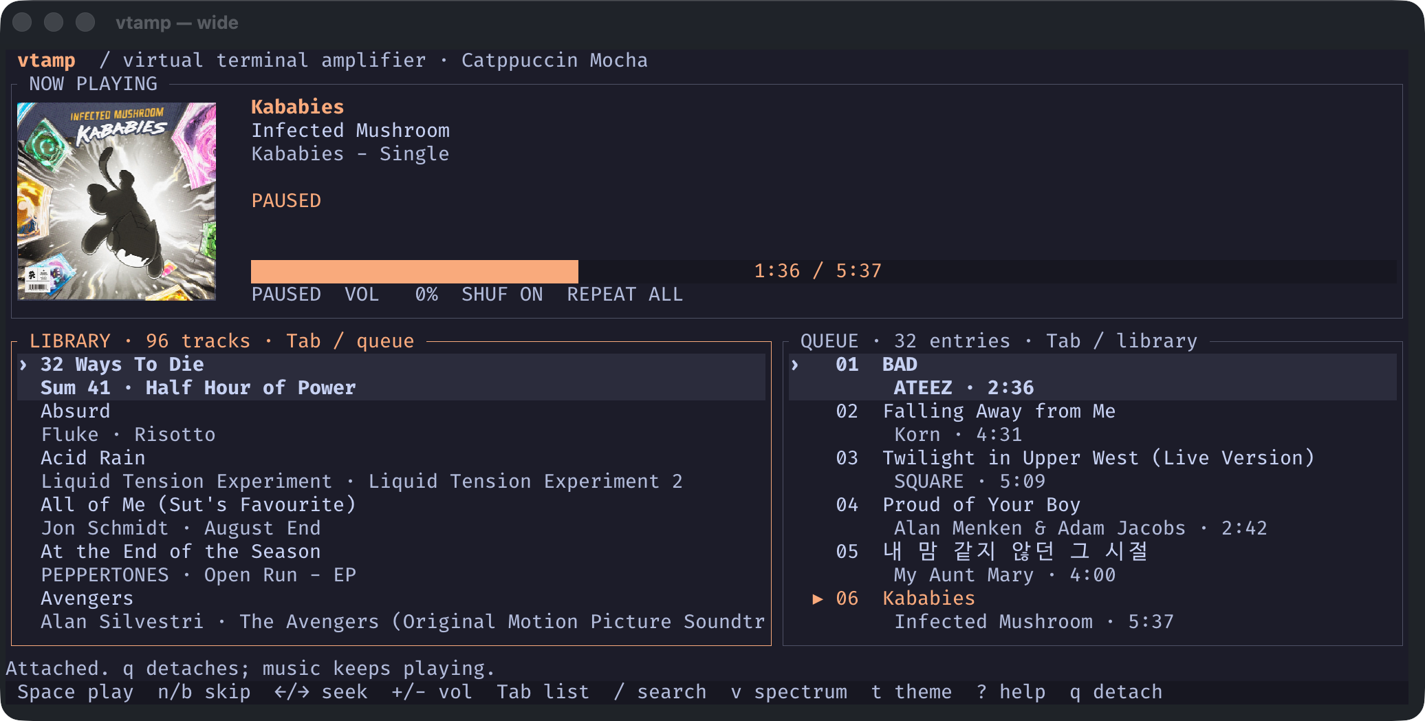 vtamp in Catppuccin Mocha: album art and current track above the Library and Queue, both visible in a wide terminal.